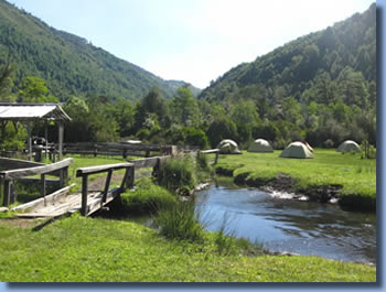 Bridge and creek at campsite on Sollipulli horse back  trek in the Andes